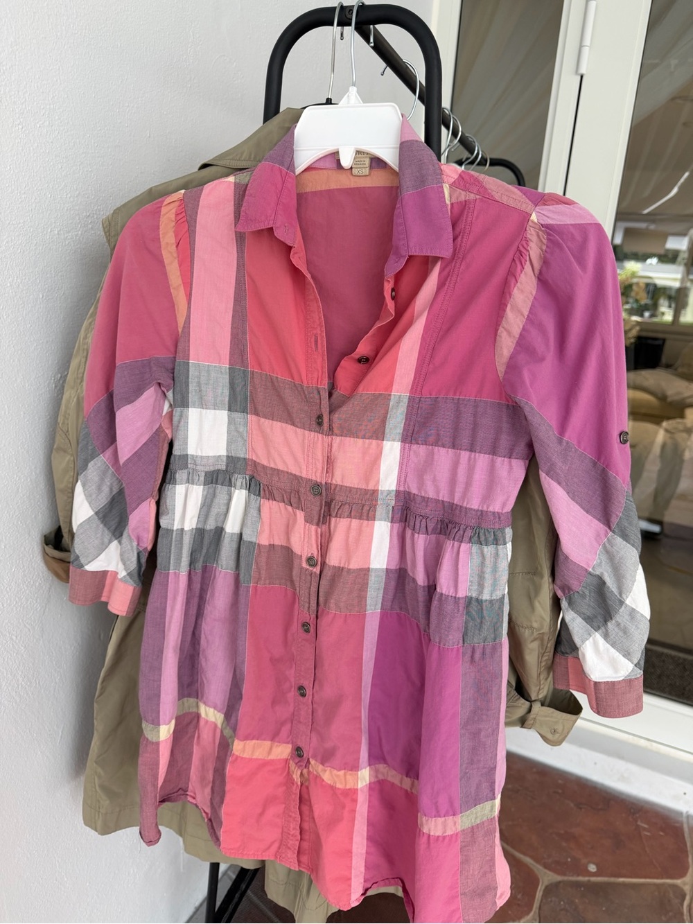 Lightweight Burberry Brit trench with pink and coral colorblock panels. Classic